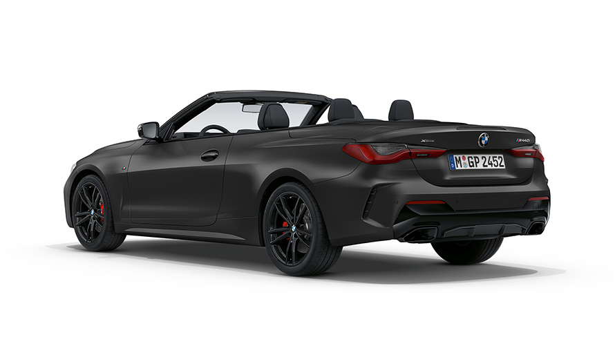 BMW M440i xDrive Cabrio G23 2020 BMW Individual Frozen Deep Grey metallic Dreiviertel-Heckansicht mit geöffnetem Stoffverdeck