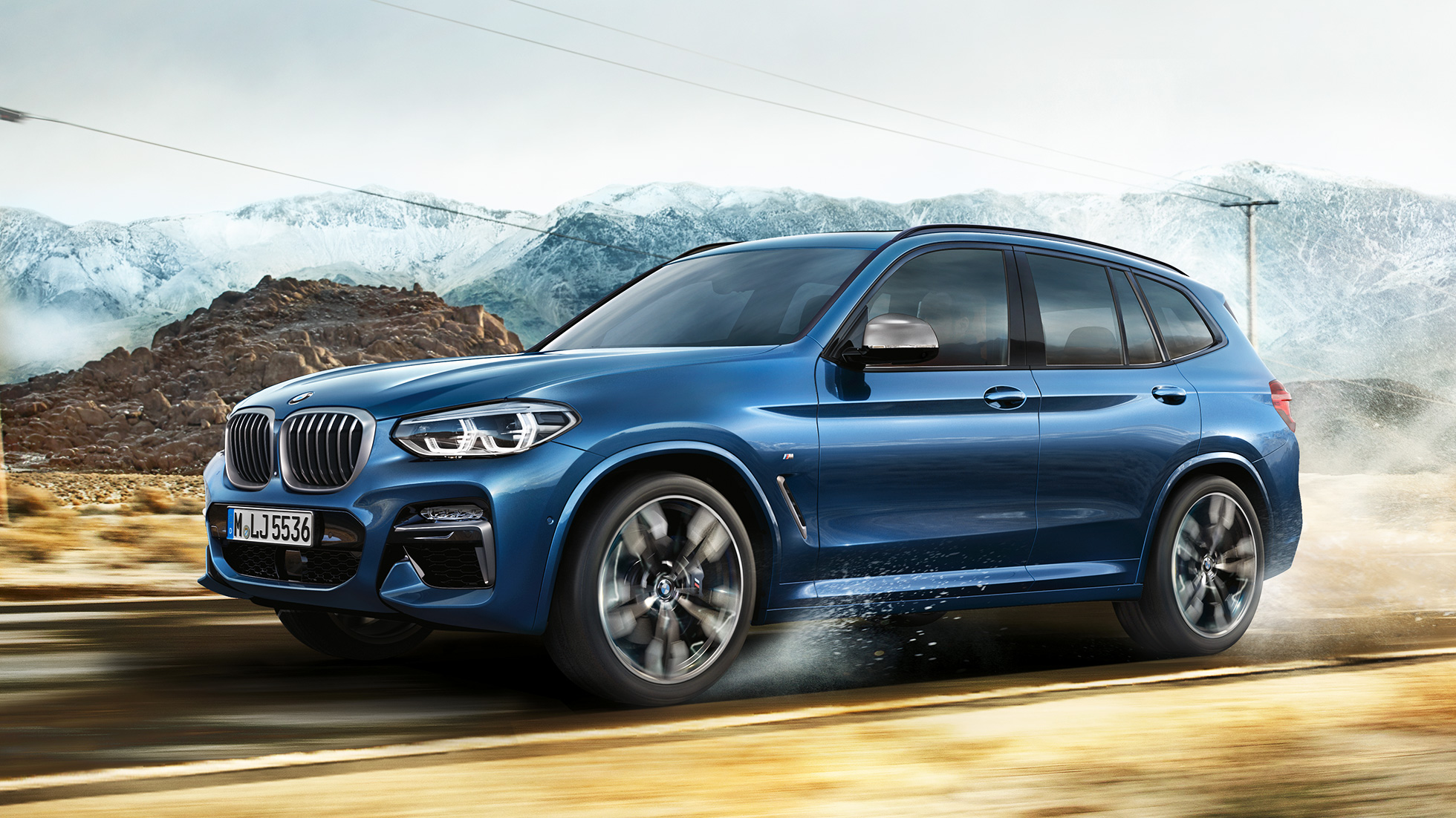 BMW X3 M40i SUV, Halbtotale Felge und Kotflügel vor Gebirge G01 BMW X3 M40i SUV, Halbtotale Felge und Kotflügel vor Gebirge G01