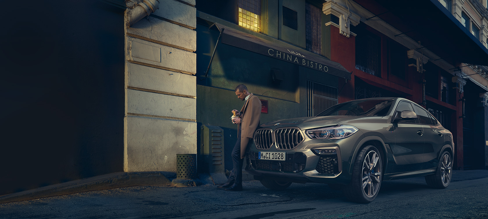 BMW X6 Dreiviertel-Frontansicht stehend BMW X6 G06 2019 Manhattan metallic Dreiviertel-Frontansicht stehend