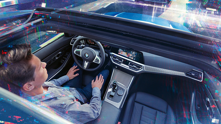 Blick ins Cockpit eines BMW Blick ins Cockpit eines BMW mit Mann am Steuer