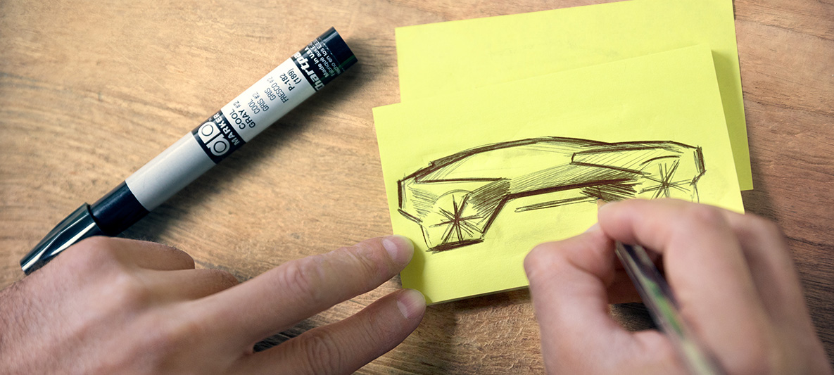 Skizze des BMW Vision iNEXT Hände zeichnen Skizze des BMW Vision iNEXT auf Post-it